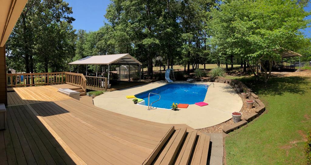 105 David Coley Road Macon, GA 31216 - Photo 2 of 6 a view of a swimming pool with a patio