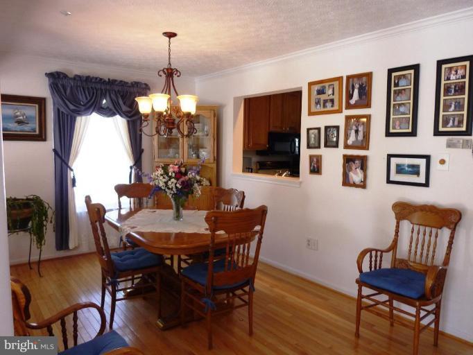 9229 Howland Road Laurel, MD 20723 - Photo 3 of 15 a dining room with furniture and window