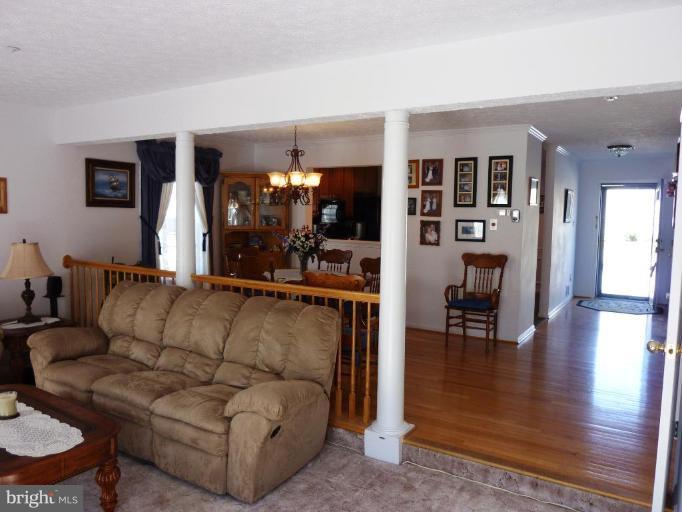 9229 Howland Road Laurel, MD 20723 - Photo 7 of 15 a living room with furniture and a wooden floor