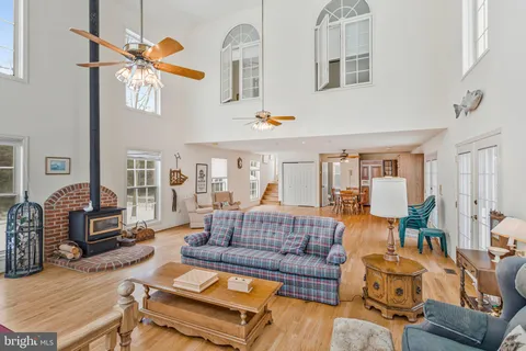 a living room with furniture a couch and dresser