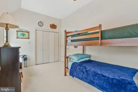 a bedroom with a bed and a cabinets
