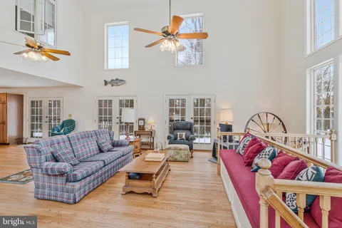 a living room with furniture fireplace and rug
