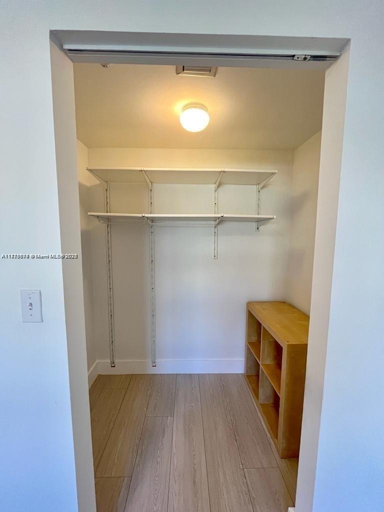2775 Northeast 187th Street, Unit 326 Aventura, FL 33180 - Photo 14 of 23 a view of storage and utility room with wooden floor
