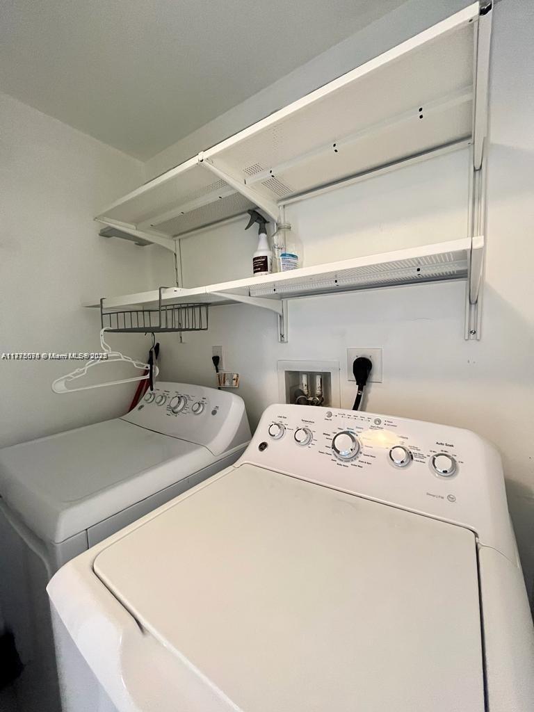 2775 Northeast 187th Street, Unit 326 Aventura, FL 33180 - Photo 18 of 23 a utility room with dryer and washer