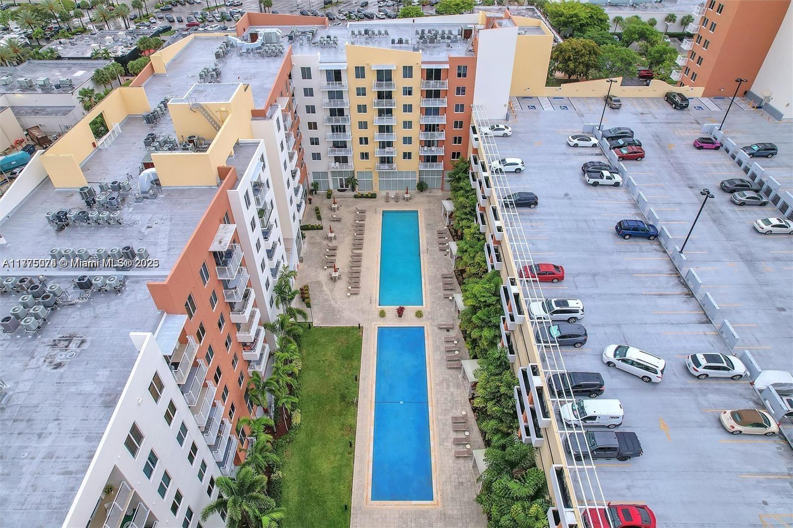 2775 Northeast 187th Street, Unit 326 Aventura, FL 33180 - Photo 4 of 23 an aerial view of residential houses with outdoor space