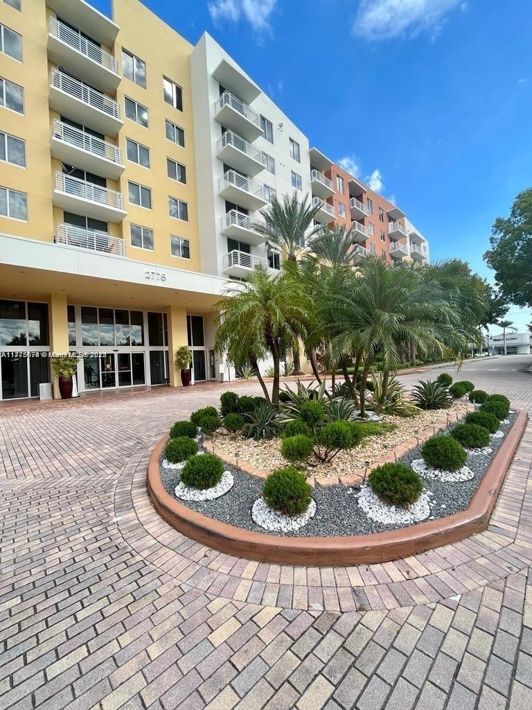 2775 Northeast 187th Street, Unit 326 Aventura, FL 33180 - Photo 8 of 23 a view of a building with backyard