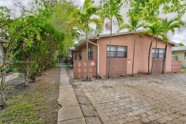 a view of backyard with swimming pool