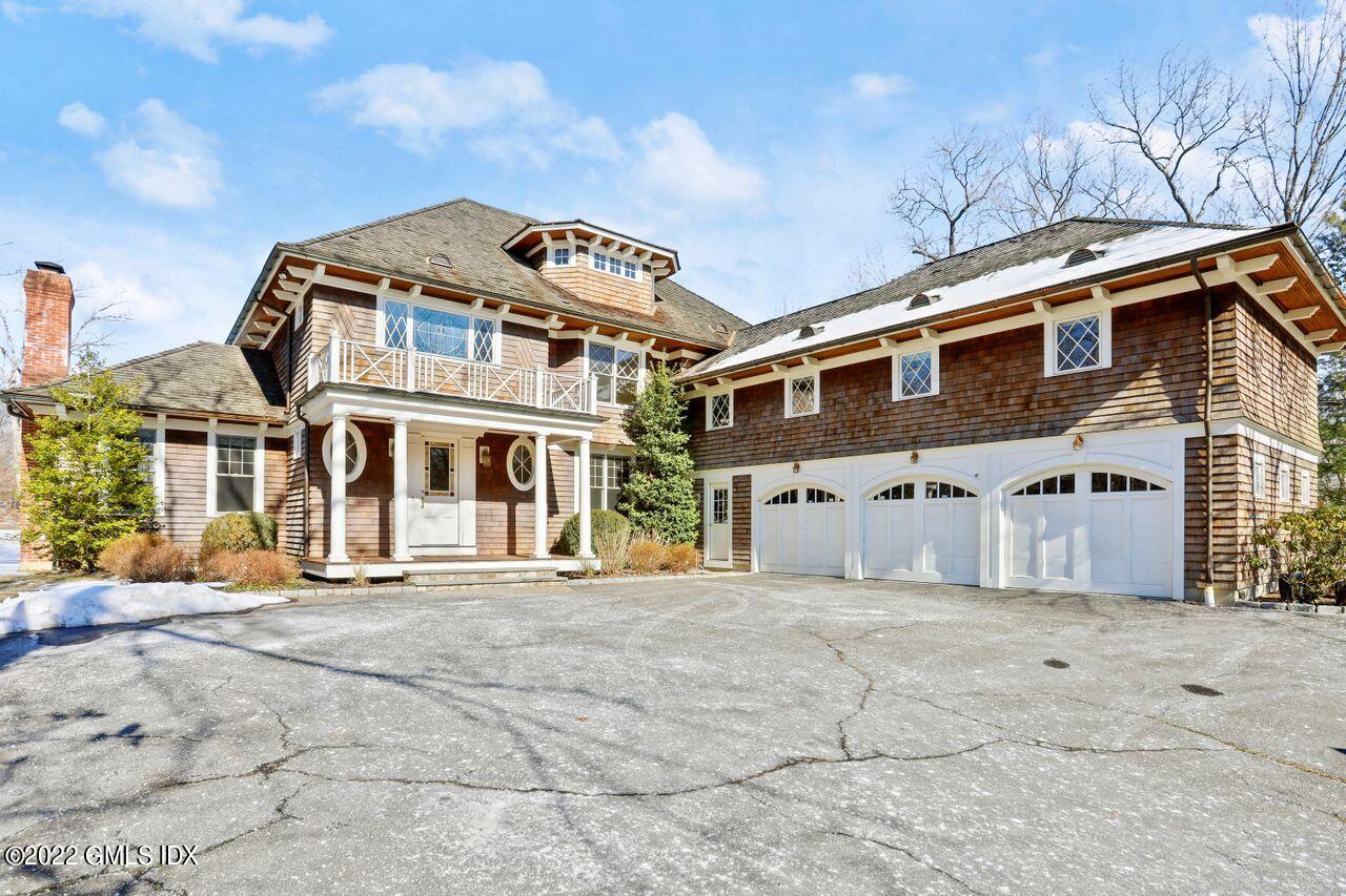 56 Frontier Road Cos Cob, CT 06807 - Photo 1 of 32 a front view of a house with a yard