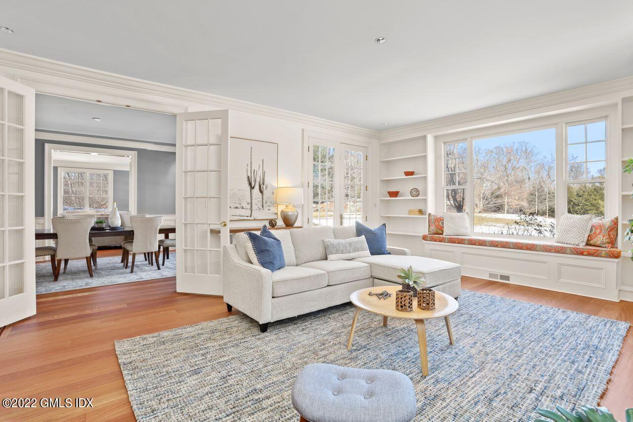 56 Frontier Road Cos Cob, CT 06807 - Photo 18 of 32 a living room with furniture and a rug