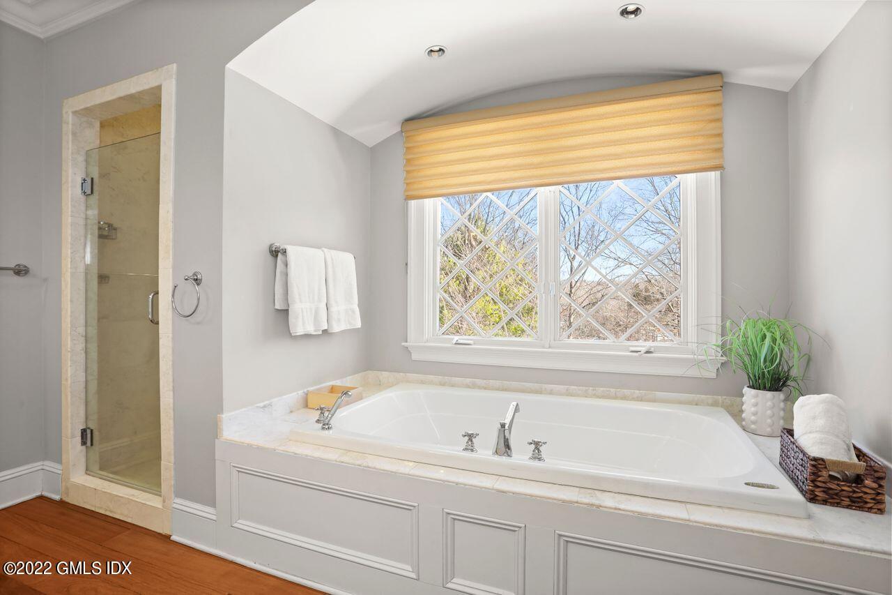 56 Frontier Road Cos Cob, CT 06807 - Photo 21 of 32 a bathroom with a bathtub and shower