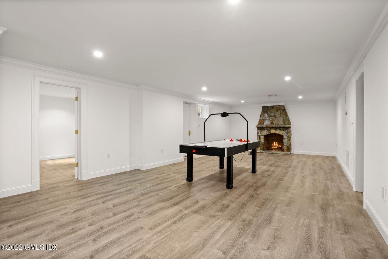 56 Frontier Road Cos Cob, CT 06807 - Photo 24 of 32 a view of a hallway with wooden floor