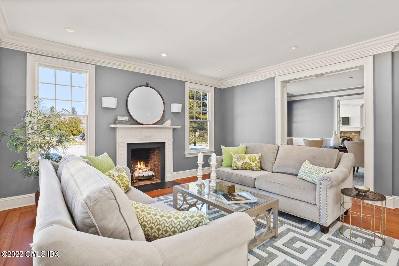 56 Frontier Road Cos Cob, CT 06807 - Photo 7 of 32 a living room with furniture and a fireplace