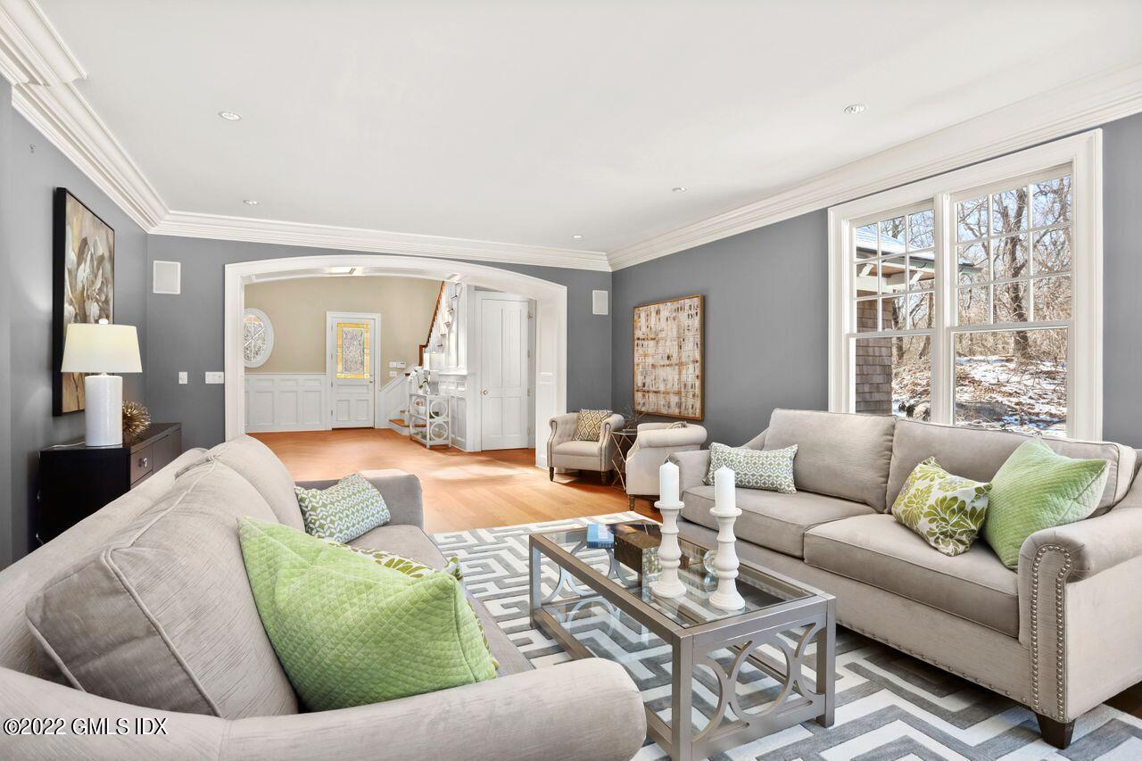56 Frontier Road Cos Cob, CT 06807 - Photo 8 of 32 a living room with furniture and a large window