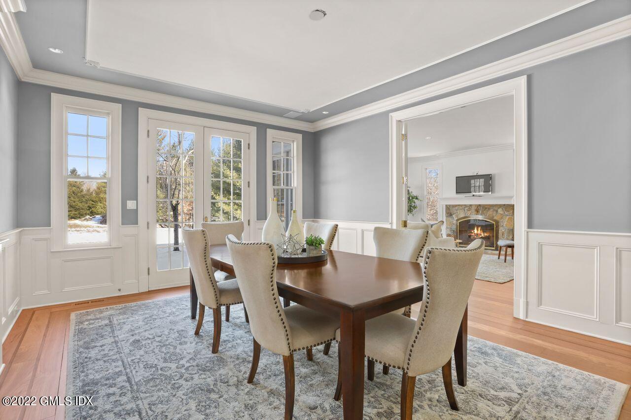 56 Frontier Road Cos Cob, CT 06807 - Photo 10 of 32 a view of a dining room with furniture window and wooden floor