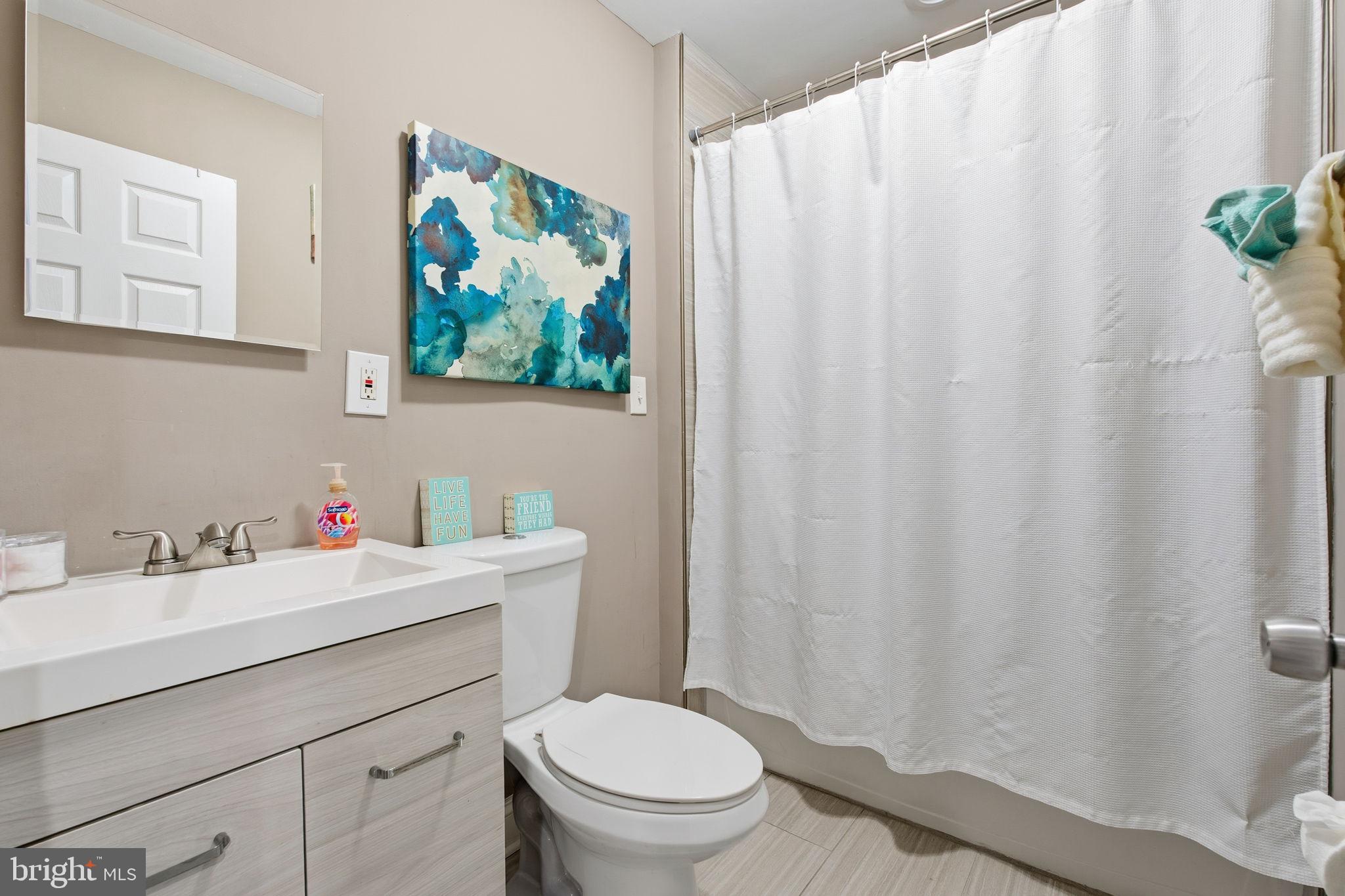 620 Yorkshire Drive Edgewood, MD 21040 - Photo 11 of 31 a bathroom with a sink a toilet and a mirror