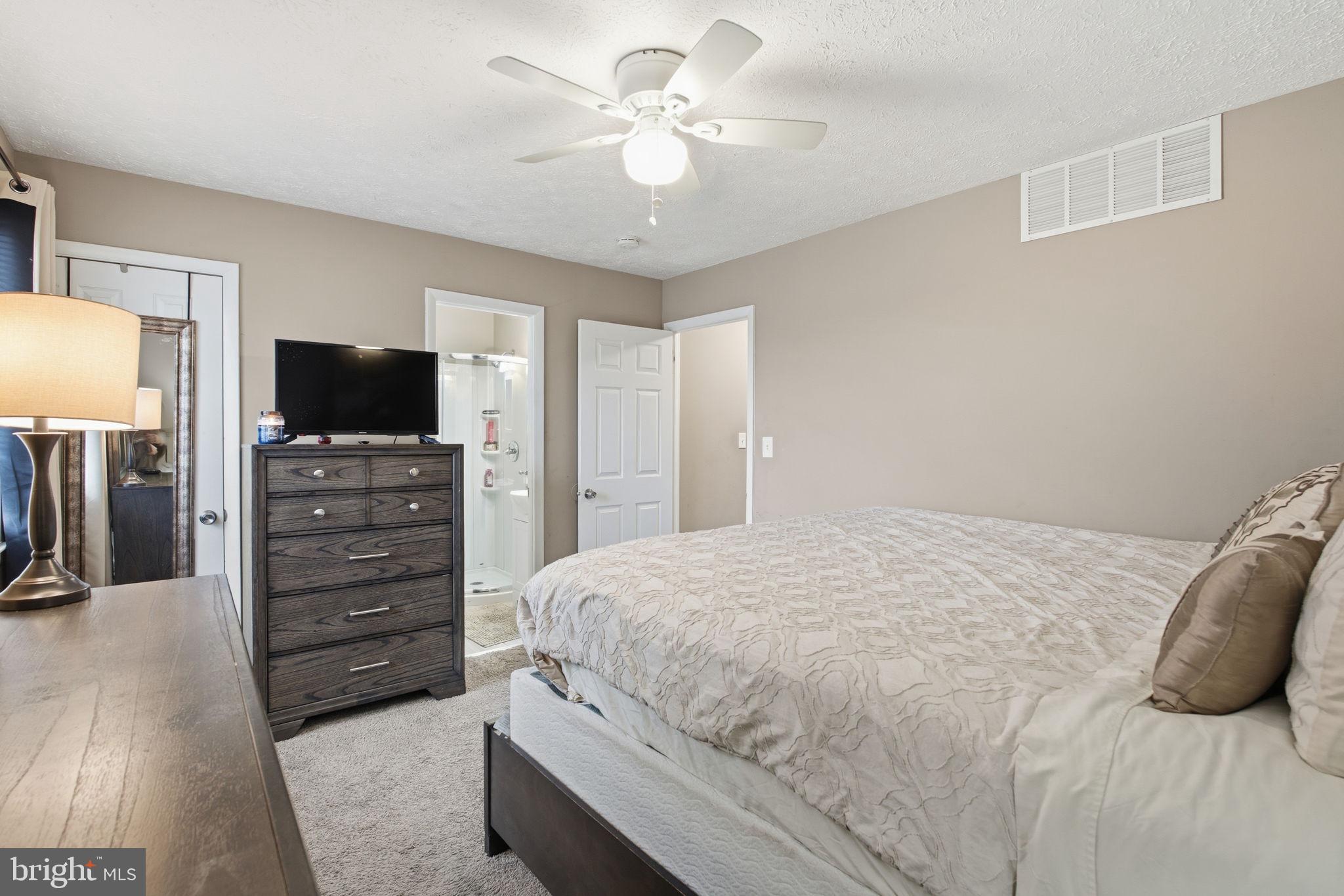 620 Yorkshire Drive Edgewood, MD 21040 - Photo 14 of 31 a bedroom with a bed and a flat screen tv