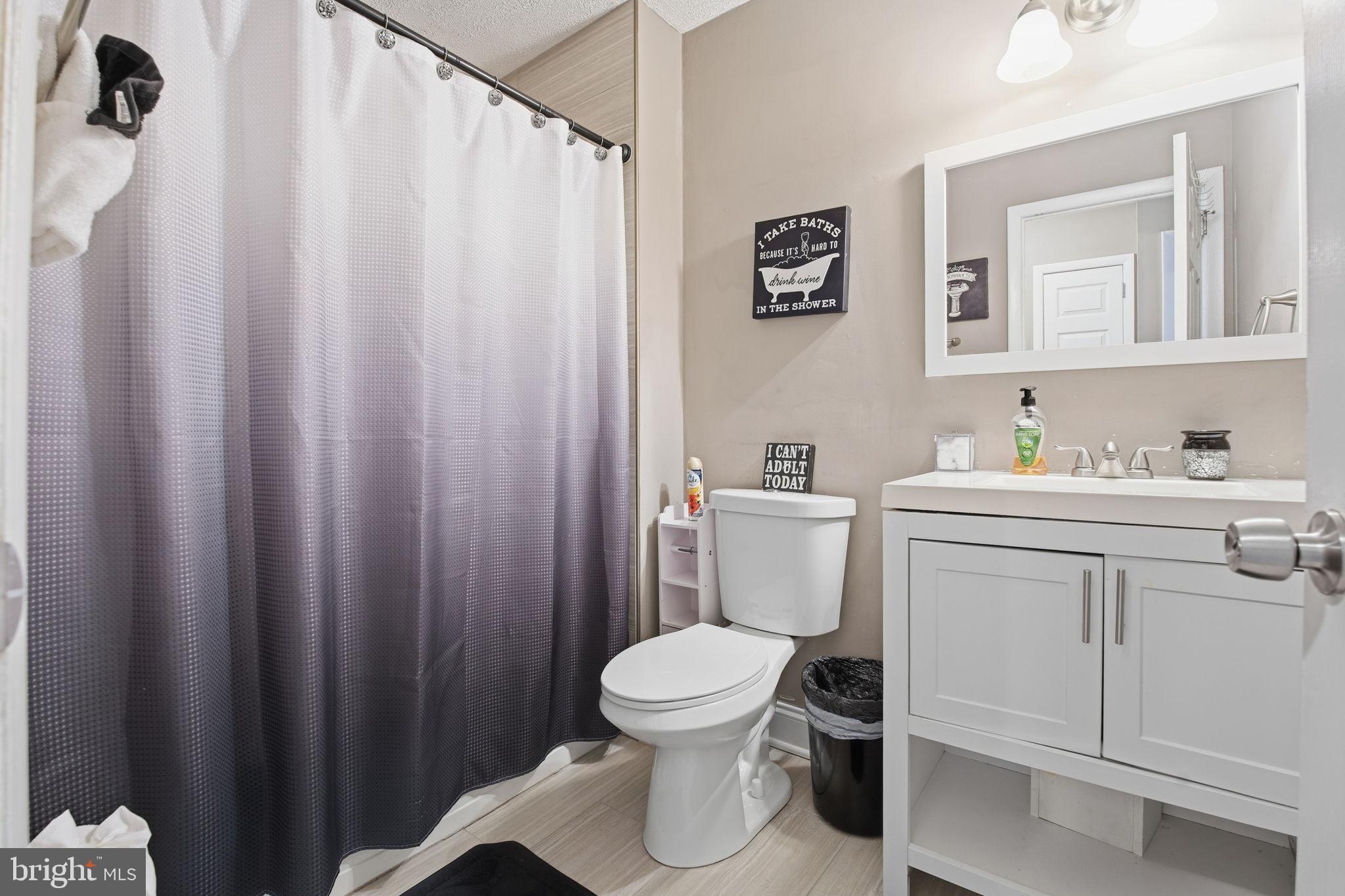 620 Yorkshire Drive Edgewood, MD 21040 - Photo 22 of 31 a bathroom with a toilet sink vanity and mirror