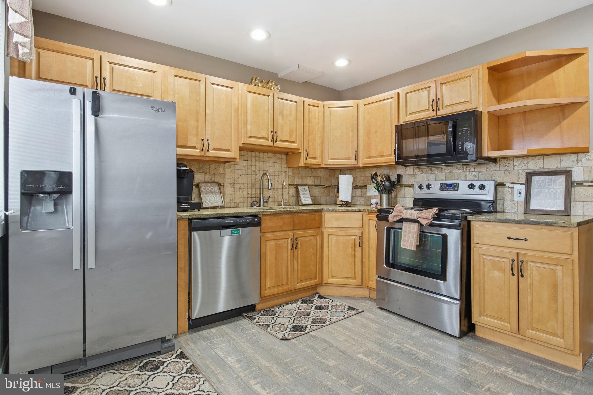 620 Yorkshire Drive Edgewood, MD 21040 - Photo 6 of 31 a kitchen with stainless steel appliances a refrigerator sink and microwave