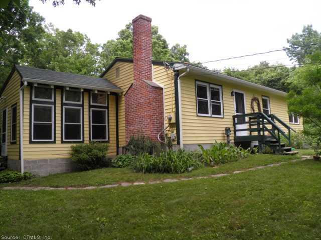 286 Woodward Road Brooklyn, CT 06234 - Photo 1 of 1 a front view of a house with garden