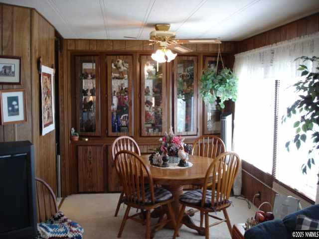 14007 Epidote Court Reno, NV 89521 - Photo 3 of 9 a view of a dining room with furniture and chandelier