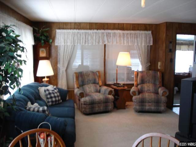 14007 Epidote Court Reno, NV 89521 - Photo 8 of 9 a living room with furniture and a large window