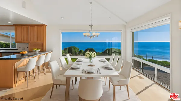 a view of a dining room with furniture window and outside view
