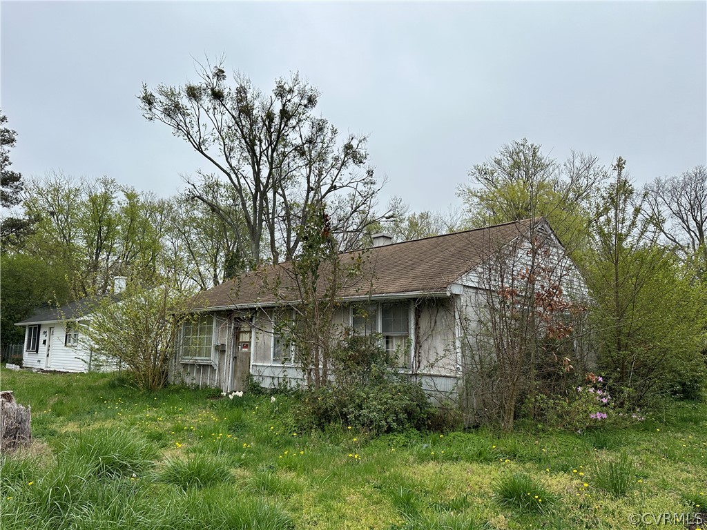 211 Roane Drive Hampton, VA 23669 - Photo 2 of 9 a front view of a house with a garden