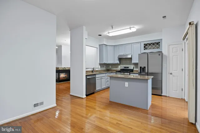 a bathroom with a toilet a sink and a mirror