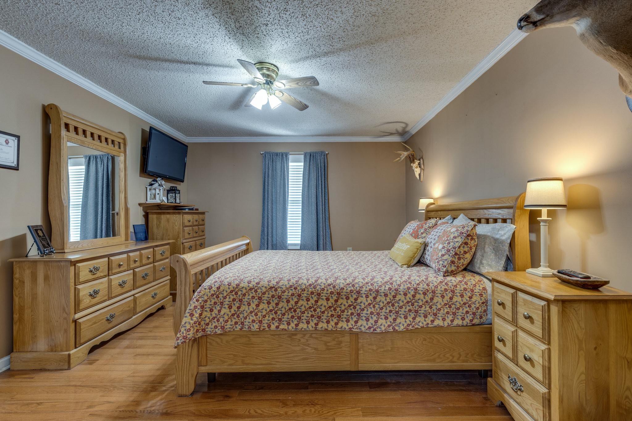 353 Major Road Cornersville, TN 37047 - Photo 11 of 74 a bedroom with a large bed and a chandelier