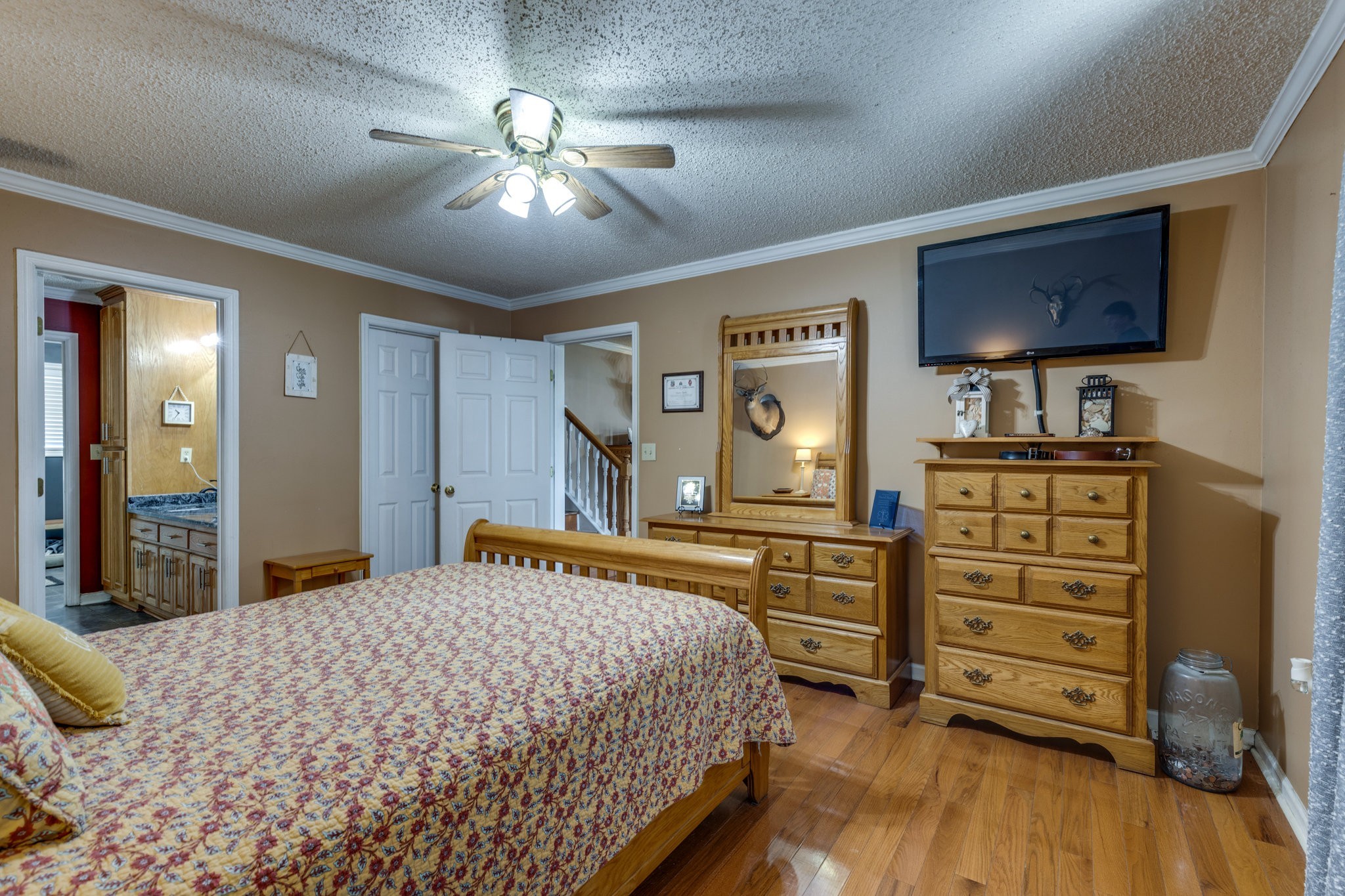 353 Major Road Cornersville, TN 37047 - Photo 13 of 74 a bedroom with a bed and a dresser in it
