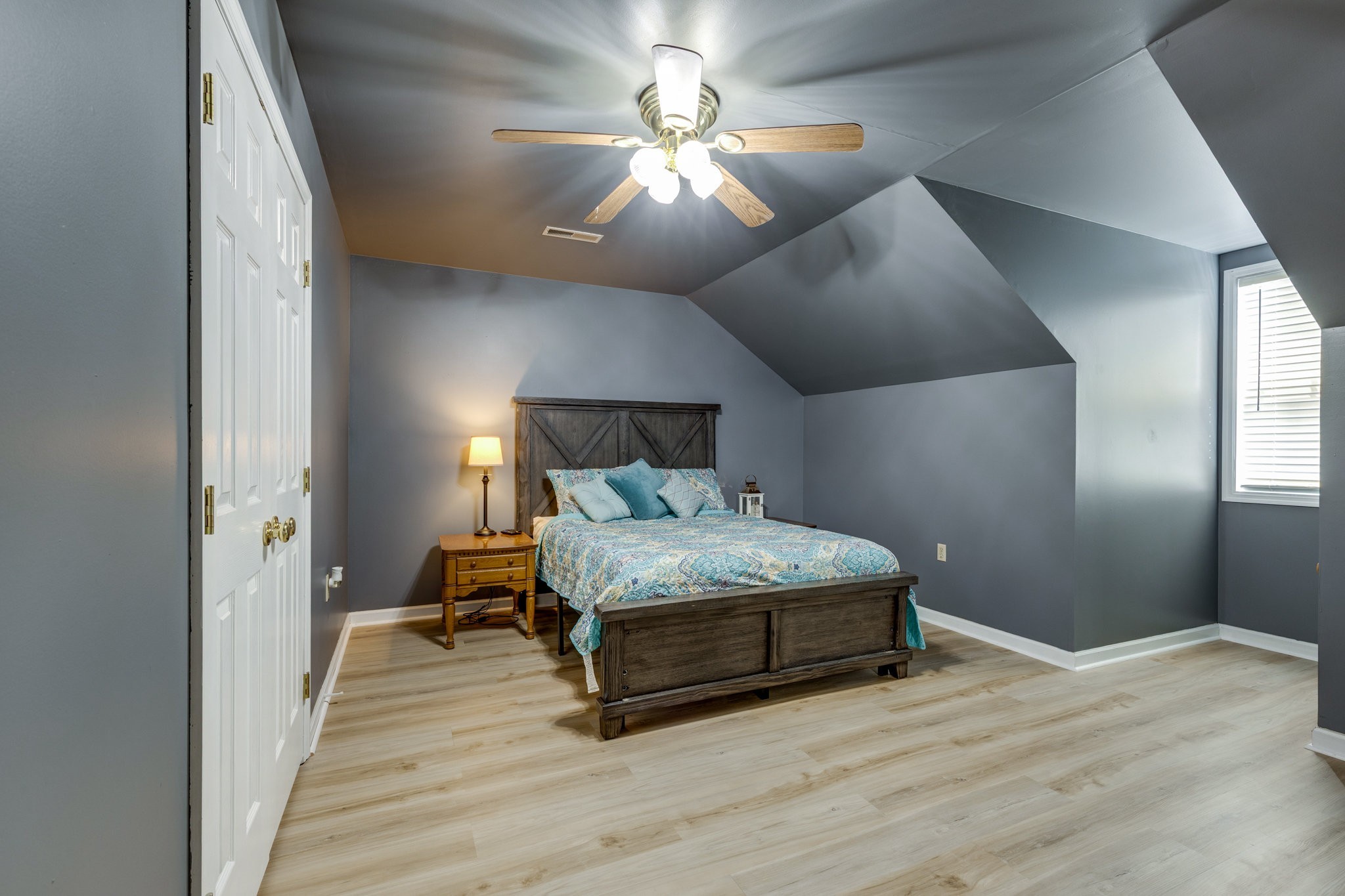 353 Major Road Cornersville, TN 37047 - Photo 23 of 74 a bedroom with a bed and a chandelier