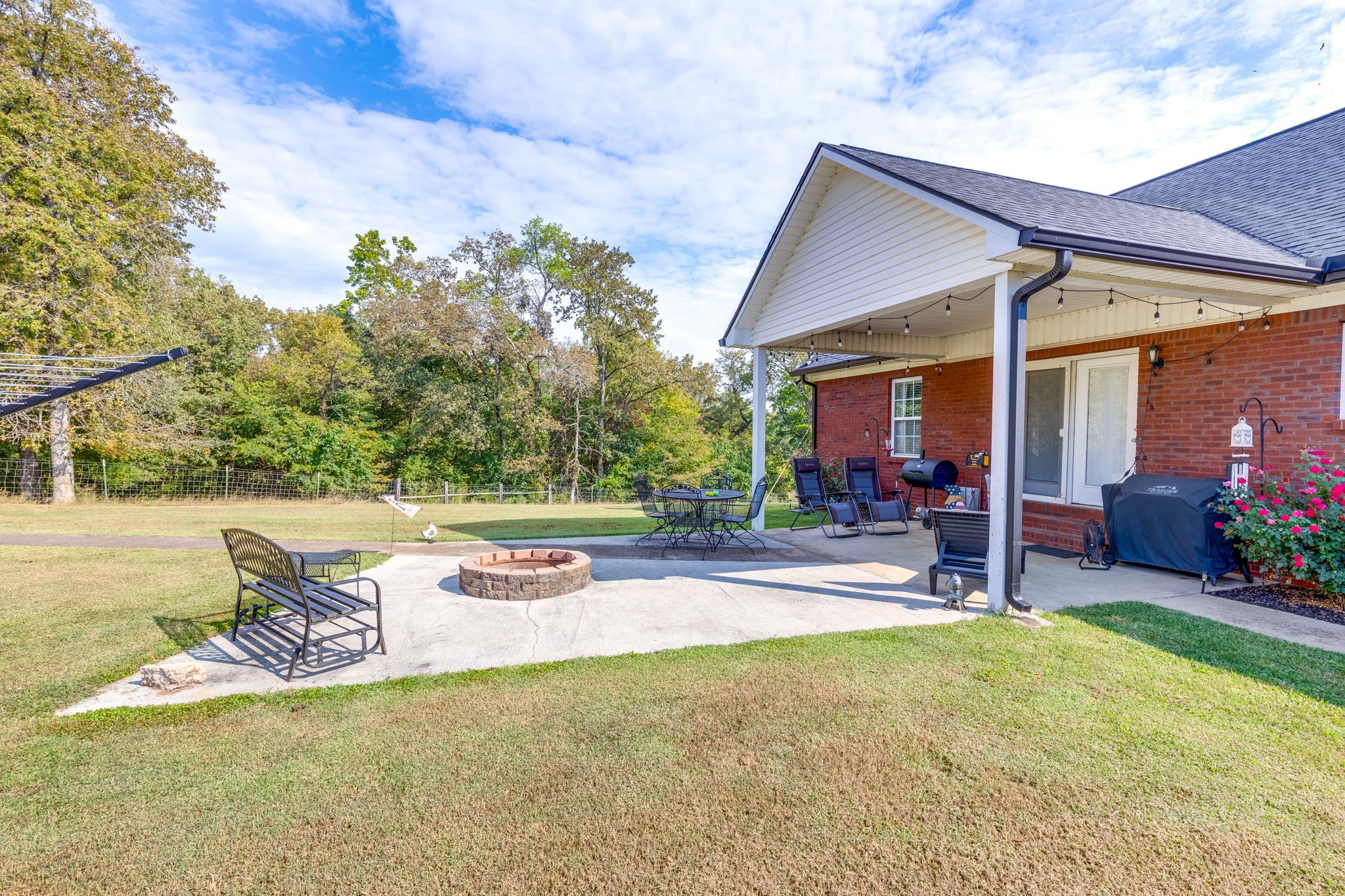 353 Major Road Cornersville, TN 37047 - Photo 32 of 74 a view of a patio with table and chairs and potted plants