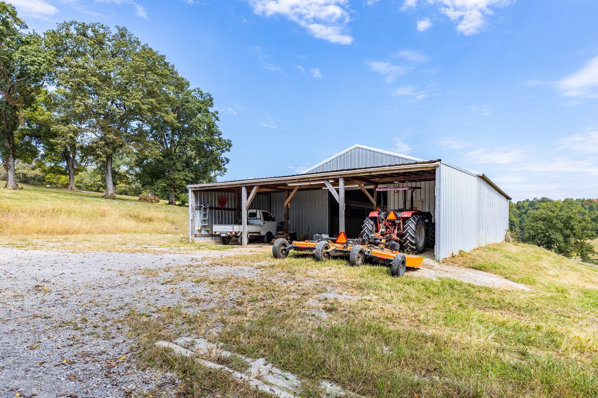 353 Major Road Cornersville, TN 37047 - Photo 38 of 74 a view of a wooden house with swimming pool and sitting area