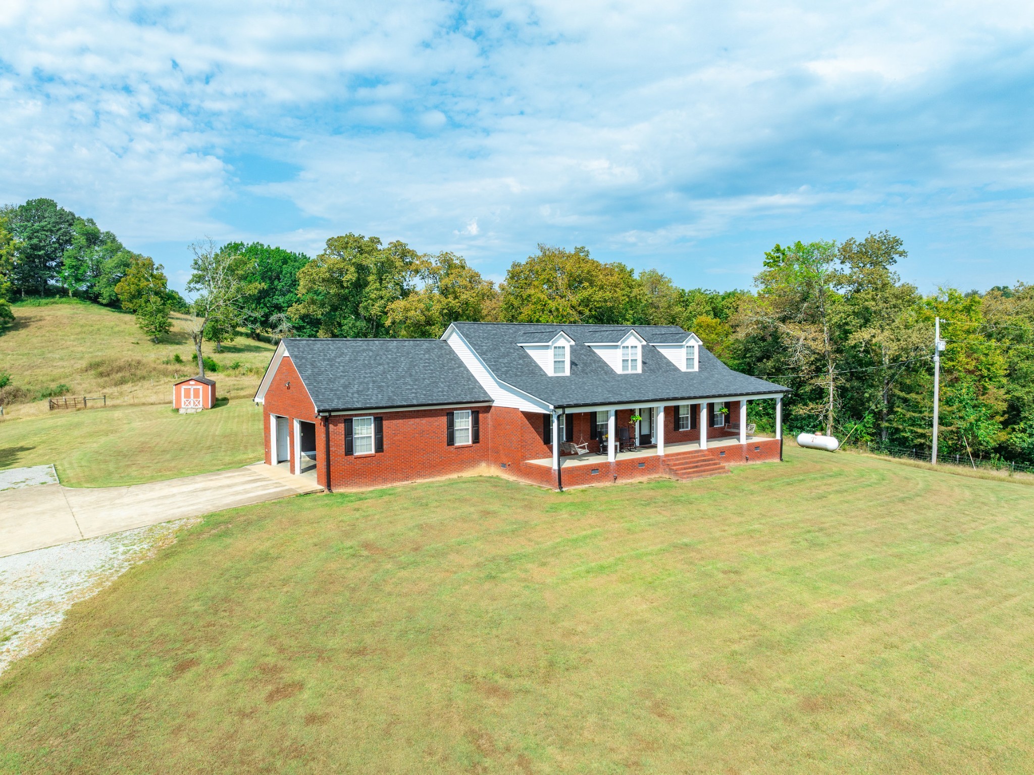 353 Major Road Cornersville, TN 37047 - Photo 44 of 74 an aerial view of residential house with pool and trees in the background