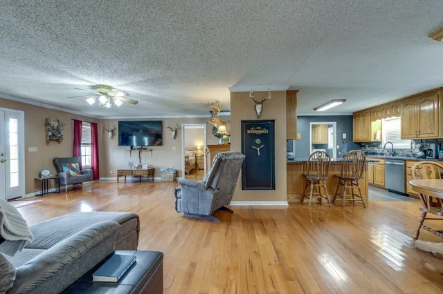 a kitchen with stainless steel appliances granite countertop refrigerator sink and stove