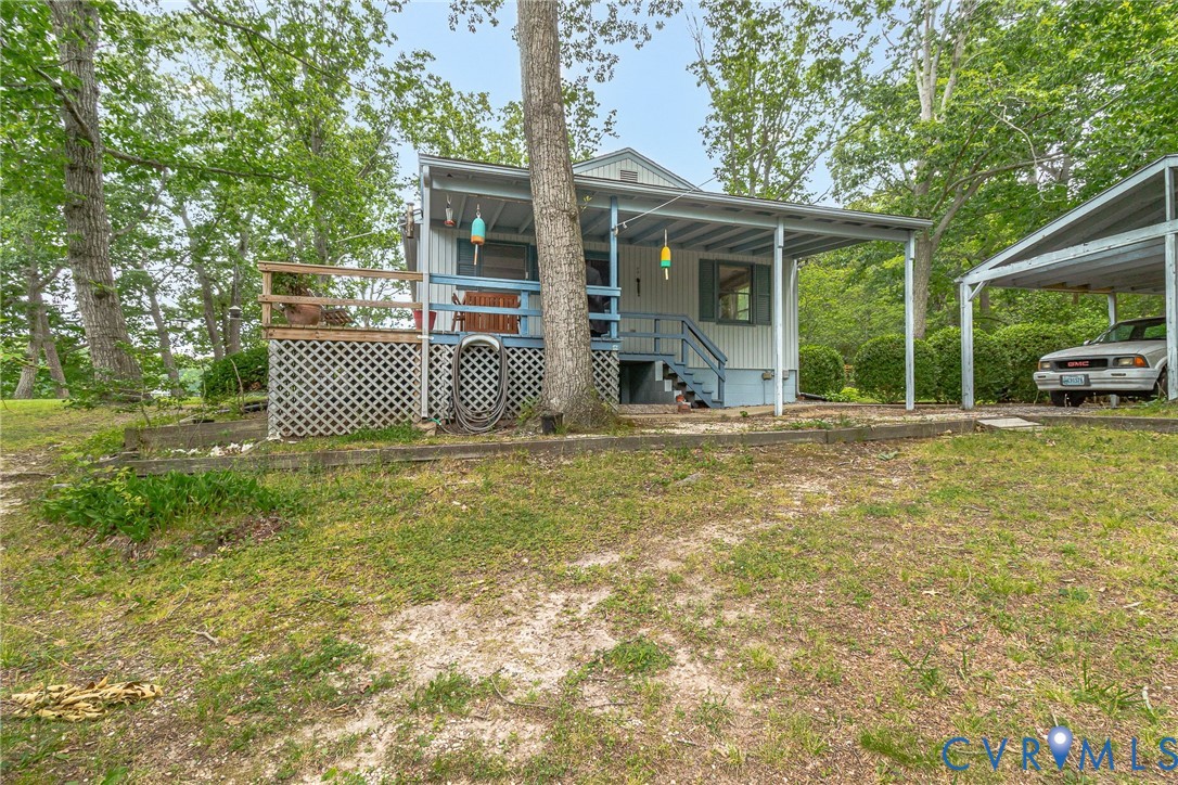 142 Bridge Lane Reedville, VA 22539 - Photo 43 of 56 a house view with a garden space