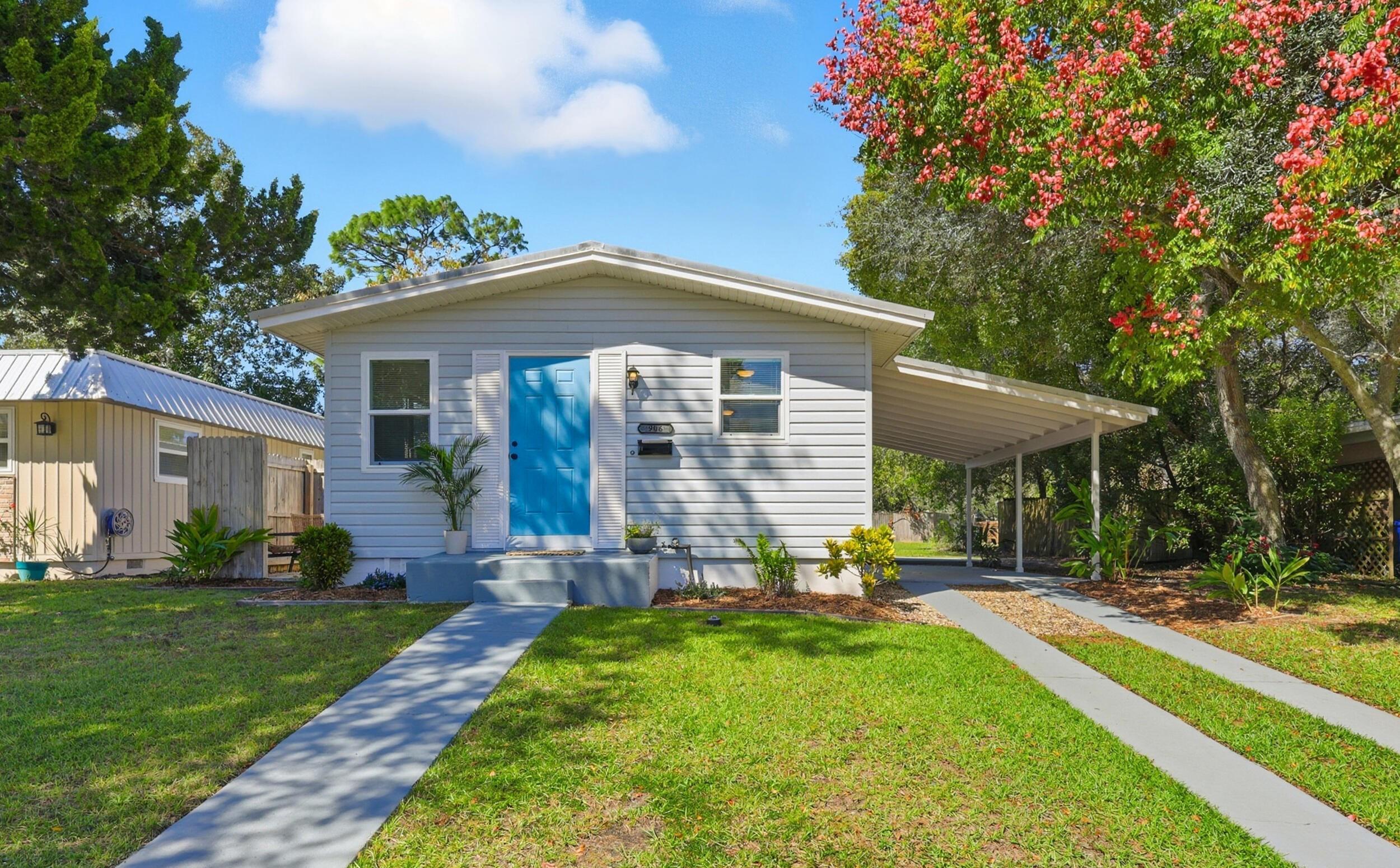 906 Palermo Road St. Augustine, FL 32086 - Photo 1 of 1 View of front facade featuring a front yard and an attached carport