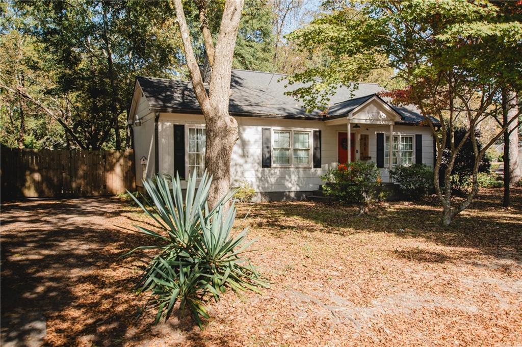 721 Davis Street Monroe, GA 30655 - Photo 1 of 20 a front view of a house with a yard