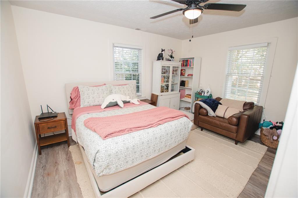 721 Davis Street Monroe, GA 30655 - Photo 11 of 20 a bedroom with a bed furniture and windows