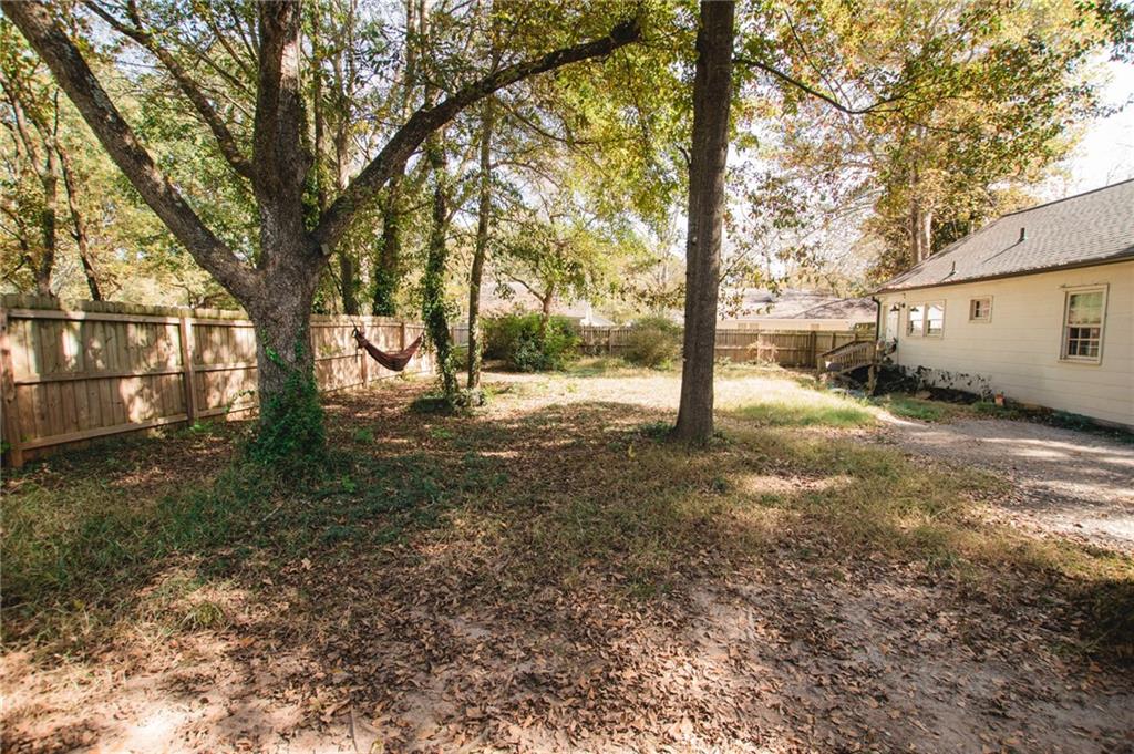 721 Davis Street Monroe, GA 30655 - Photo 17 of 20 a view of a tree in the middle of a yard