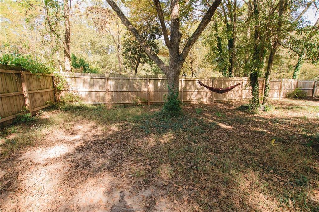 721 Davis Street Monroe, GA 30655 - Photo 20 of 20 a backyard of a house with lots of green space
