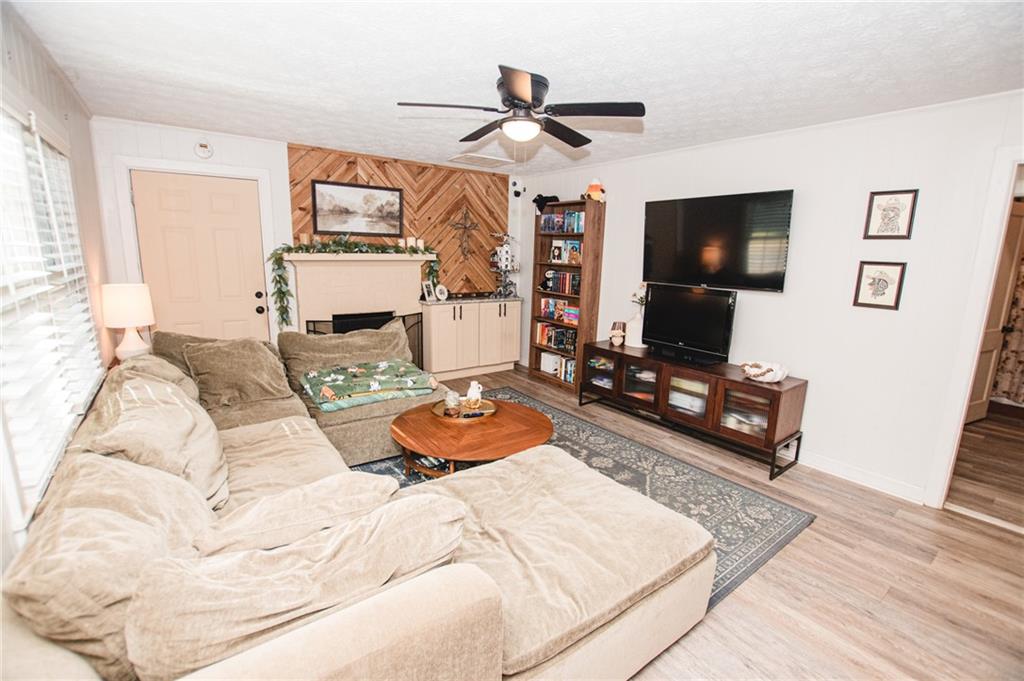 721 Davis Street Monroe, GA 30655 - Photo 5 of 20 a bedroom with a bed and a flat screen tv