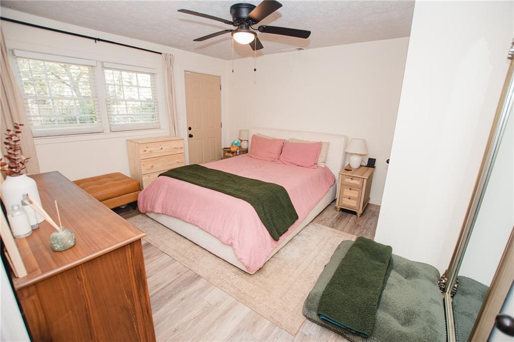 721 Davis Street Monroe, GA 30655 - Photo 10 of 20 a bedroom with a bed and a window