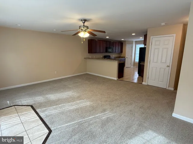 a view of a kitchen with a sink and cabinets