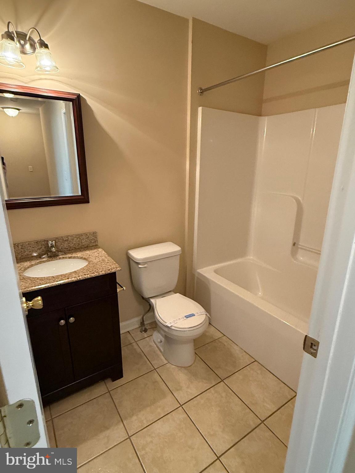 202 Bell Tower Court Stafford, VA 22554 - Photo 19 of 20 a bathroom with a sink a toilet and shower