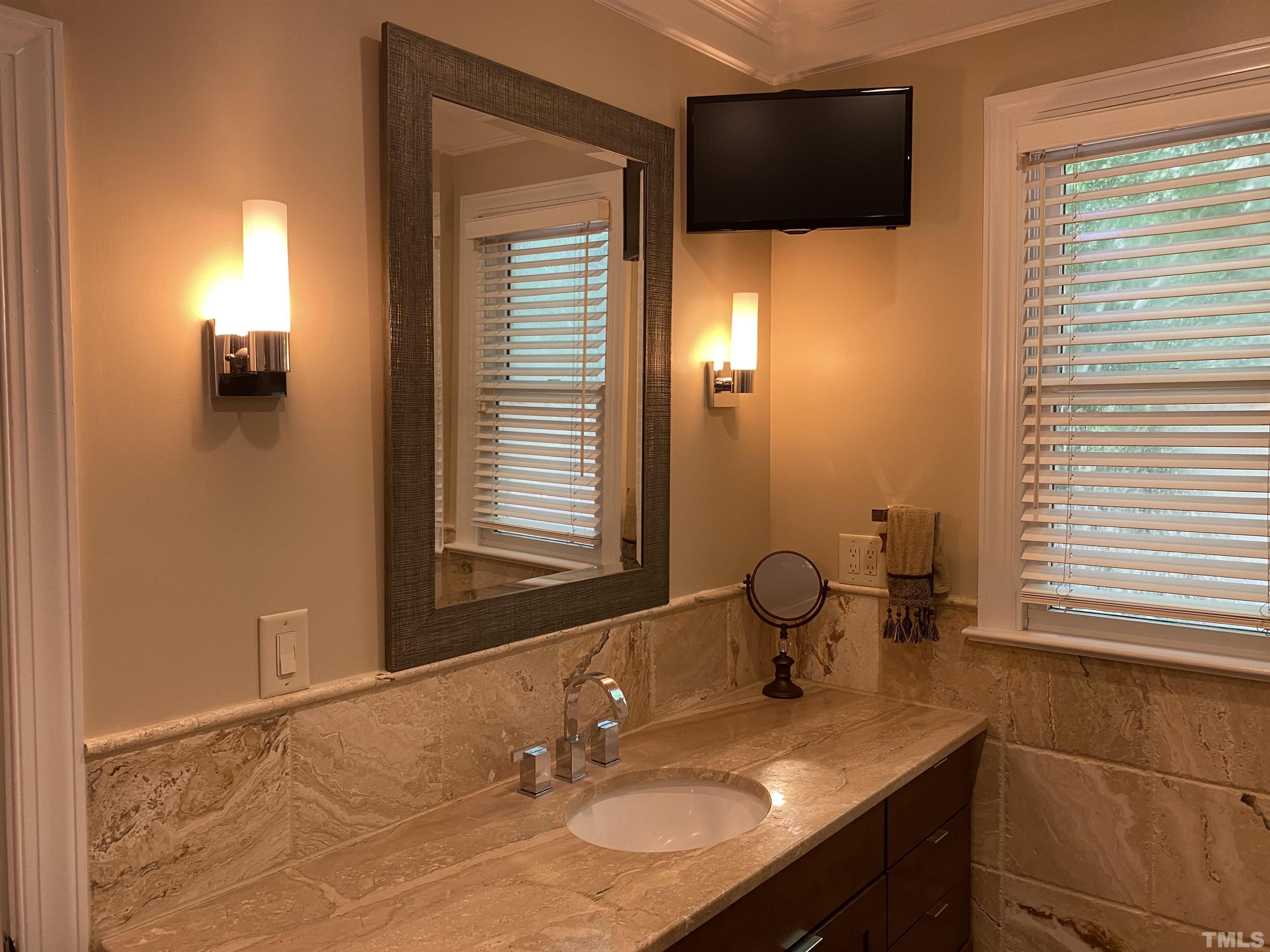 3940 White Chapel Way Raleigh, NC 27615 - Photo 4 of 40 a bathroom with a sink and a mirror