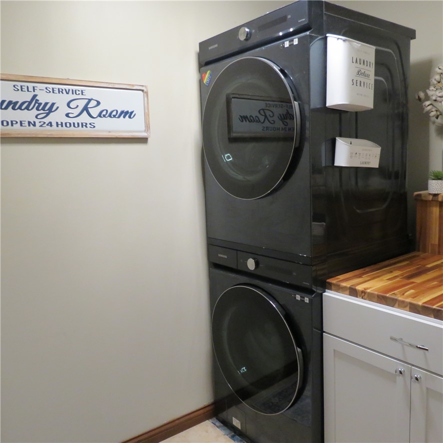 10160 Lochard Road Sidney, OH 45365 - Photo 27 of 41 This dedicated space offers convenient laundry solutions with modern appliances and functional design.
