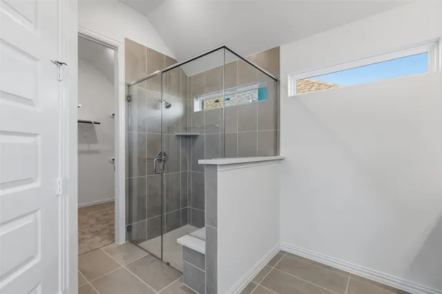 a bathroom with a shower and toilet