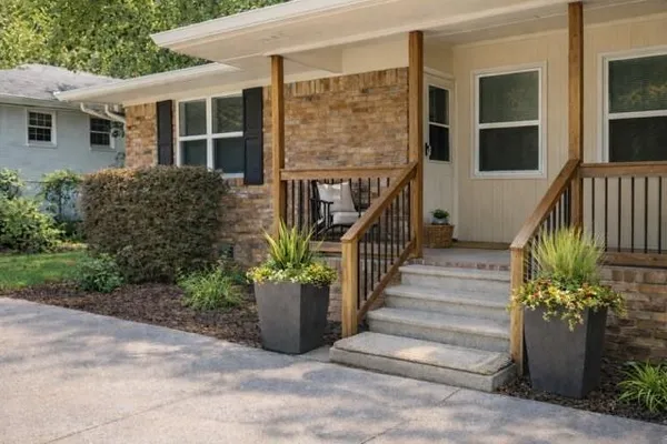 a front view of a house with a garden