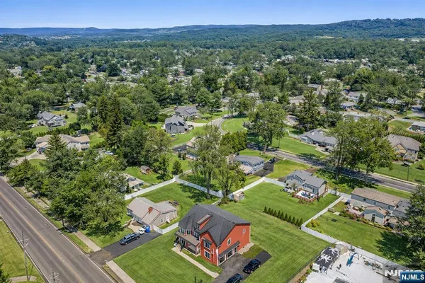 a view of staircase with furniture and a window